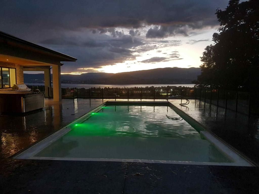 Pool and surrounding deck at dusk
